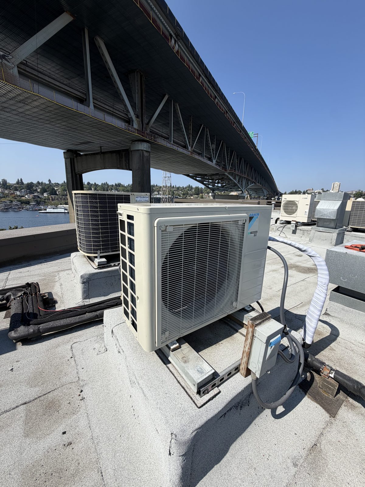 Daikin heat pump installed on a rooftop near the Aurora Bridge in Seattle