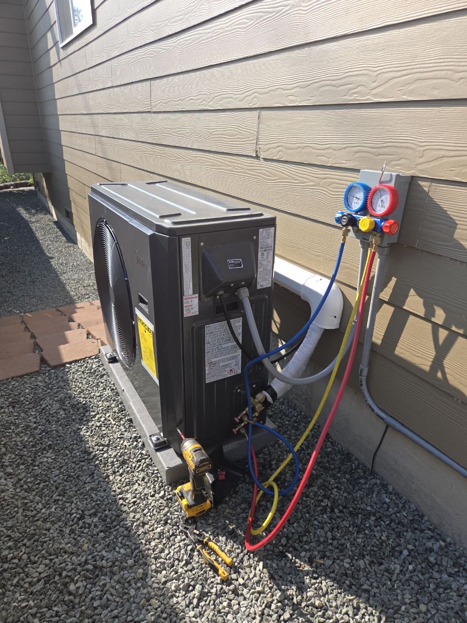 A Yeti technician diagnosing a system with gauges